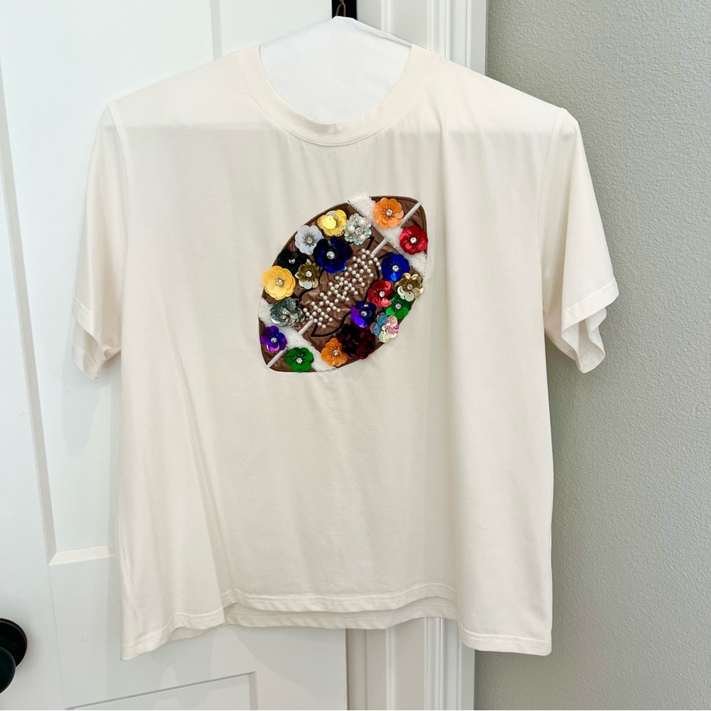 QUEEN OF SPARKLES Off White 3D Flower Rainbow Football Tee Top Game Day Sports